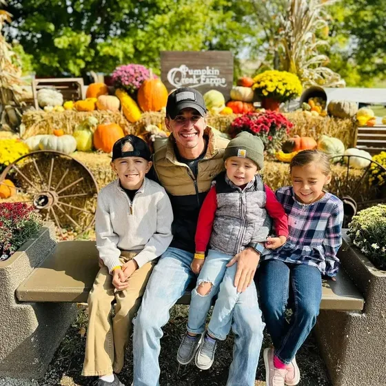 Connor Prior with his children at a pumpkin farm