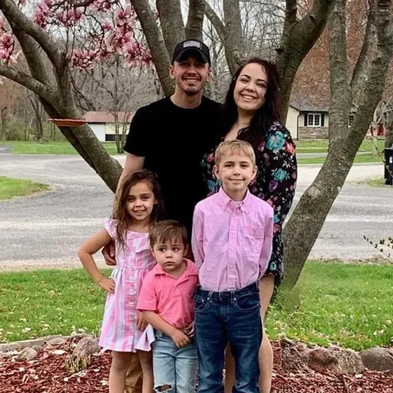 Sara Prior with her husband and children outdoors